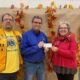 GECRC board president accepting a check from the Glen Ellyn Lions Club