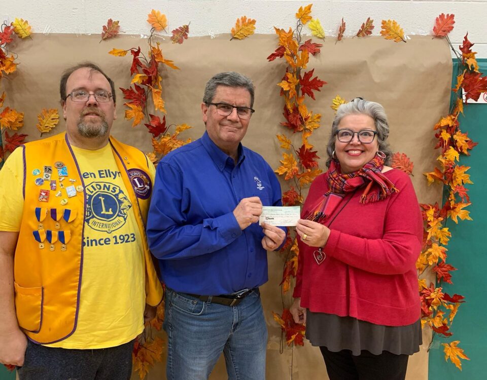 GECRC board president accepting a check from the Glen Ellyn Lions Club
